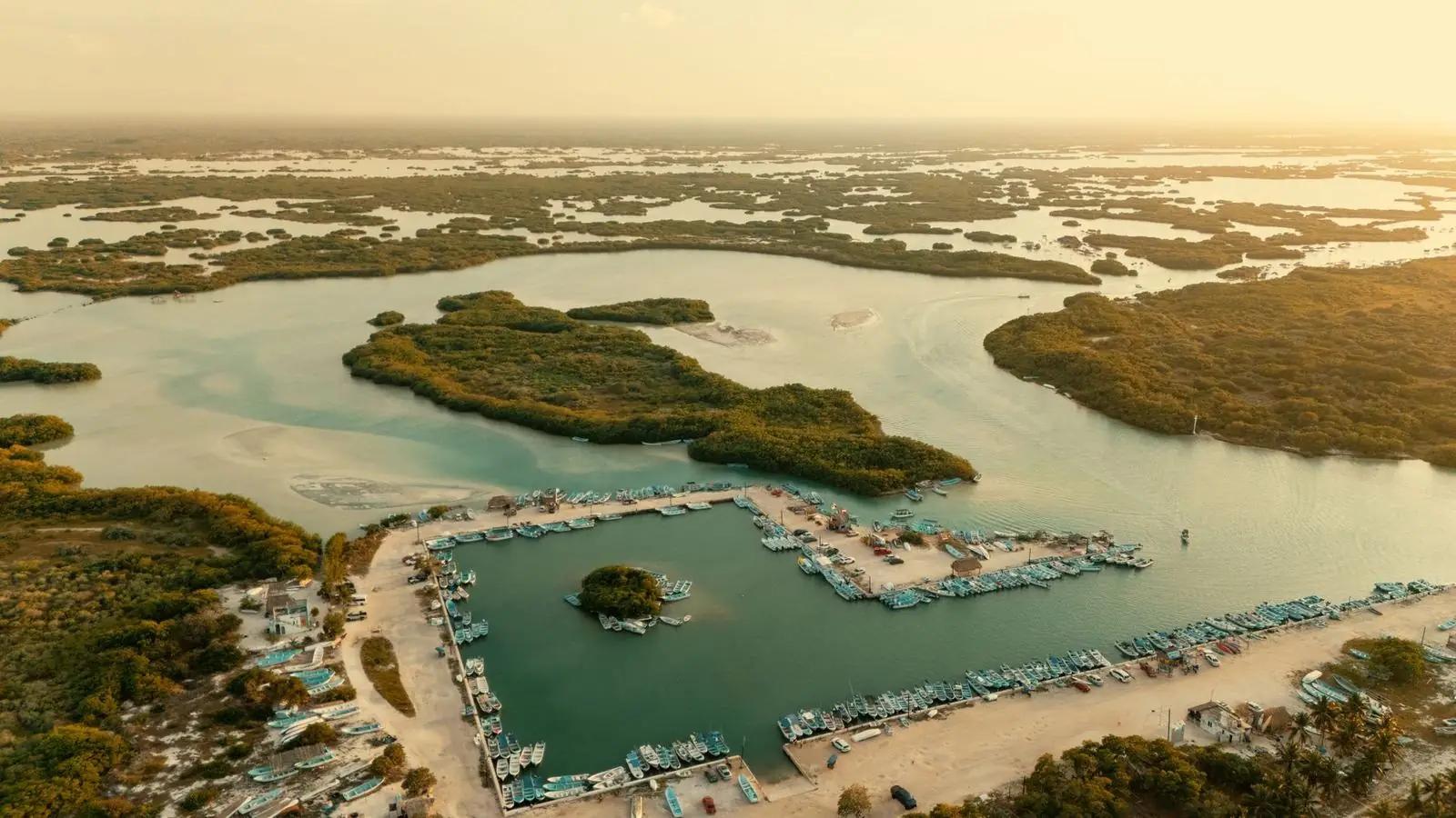 Aerial view of Naples Bay at evening with boats, docks and mangrove channels